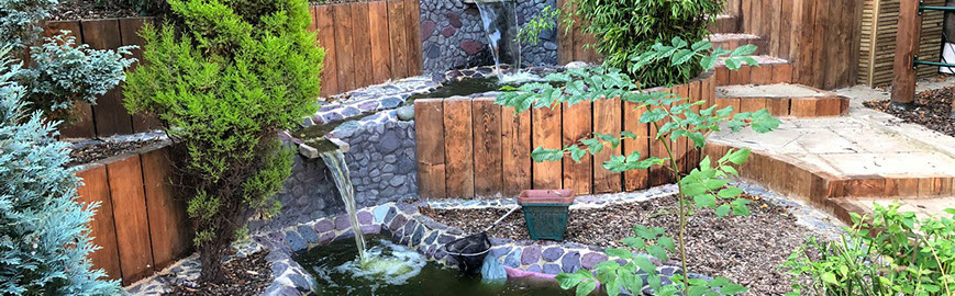 Joseph Mat Landscape,  featheredge fence ,  sandstone paving, beds, brick step